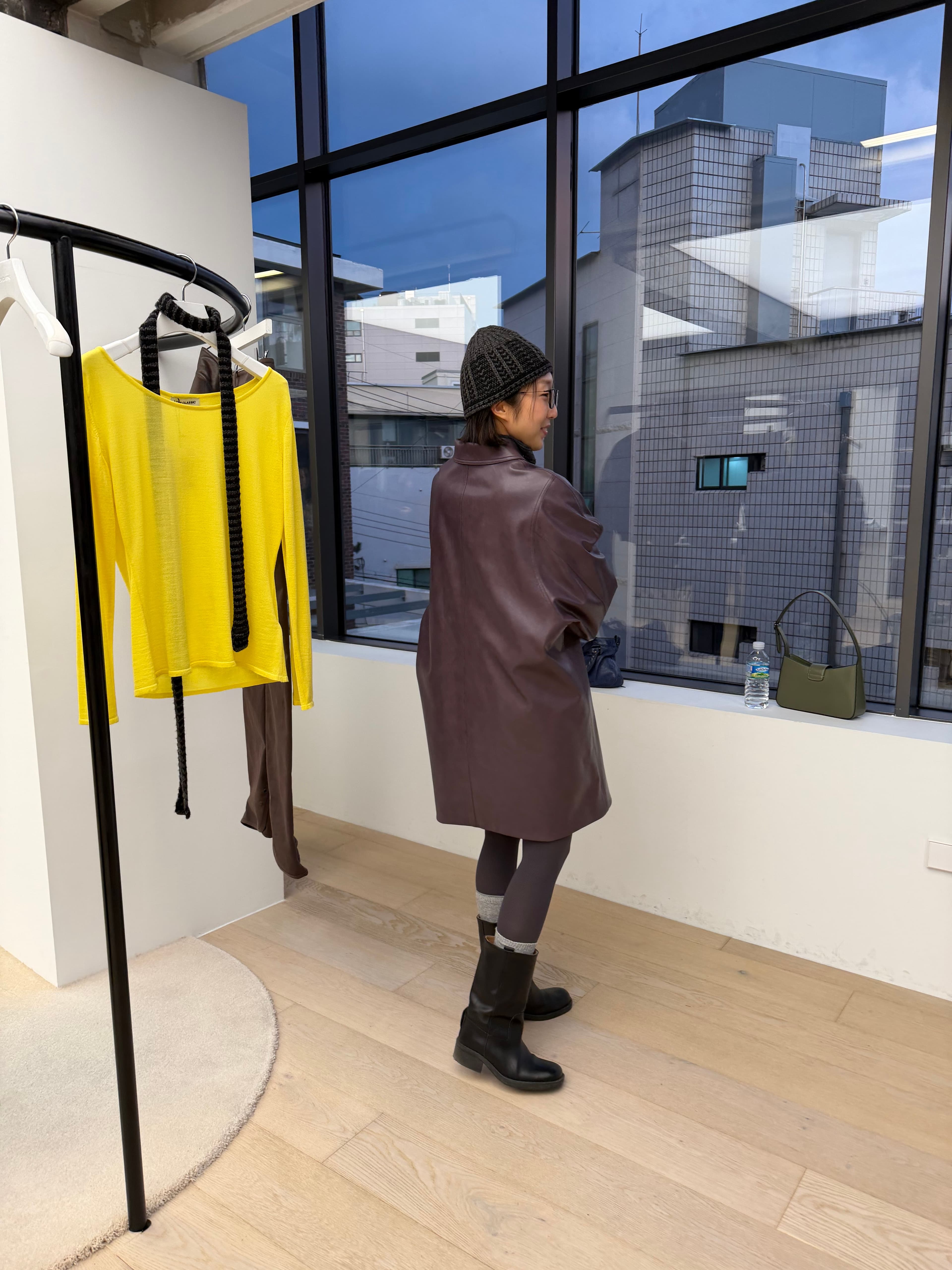 Yeonju trying a cute leather coat at Low Classic