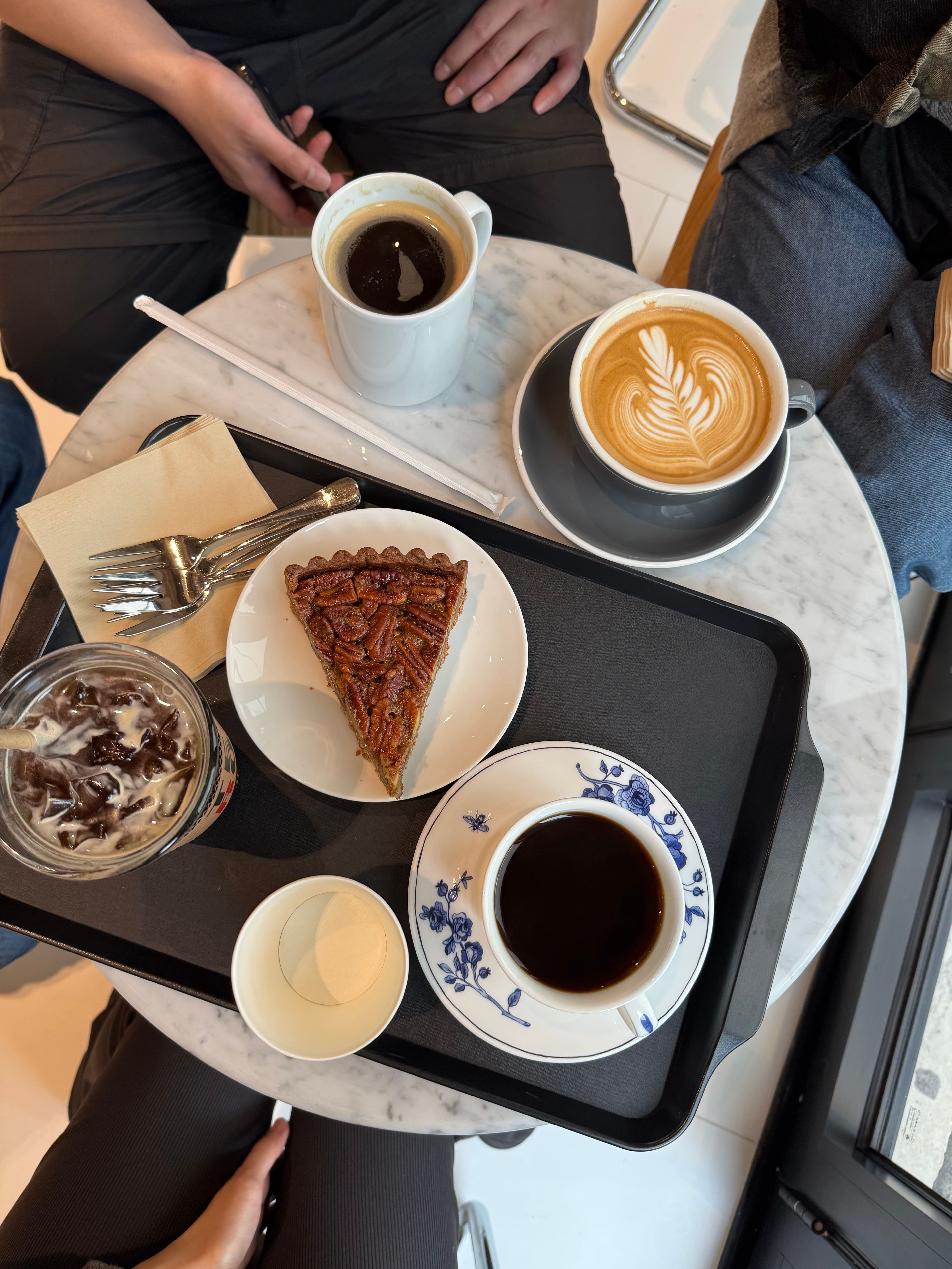 small, cozy chat over drinks at a cafe full of families